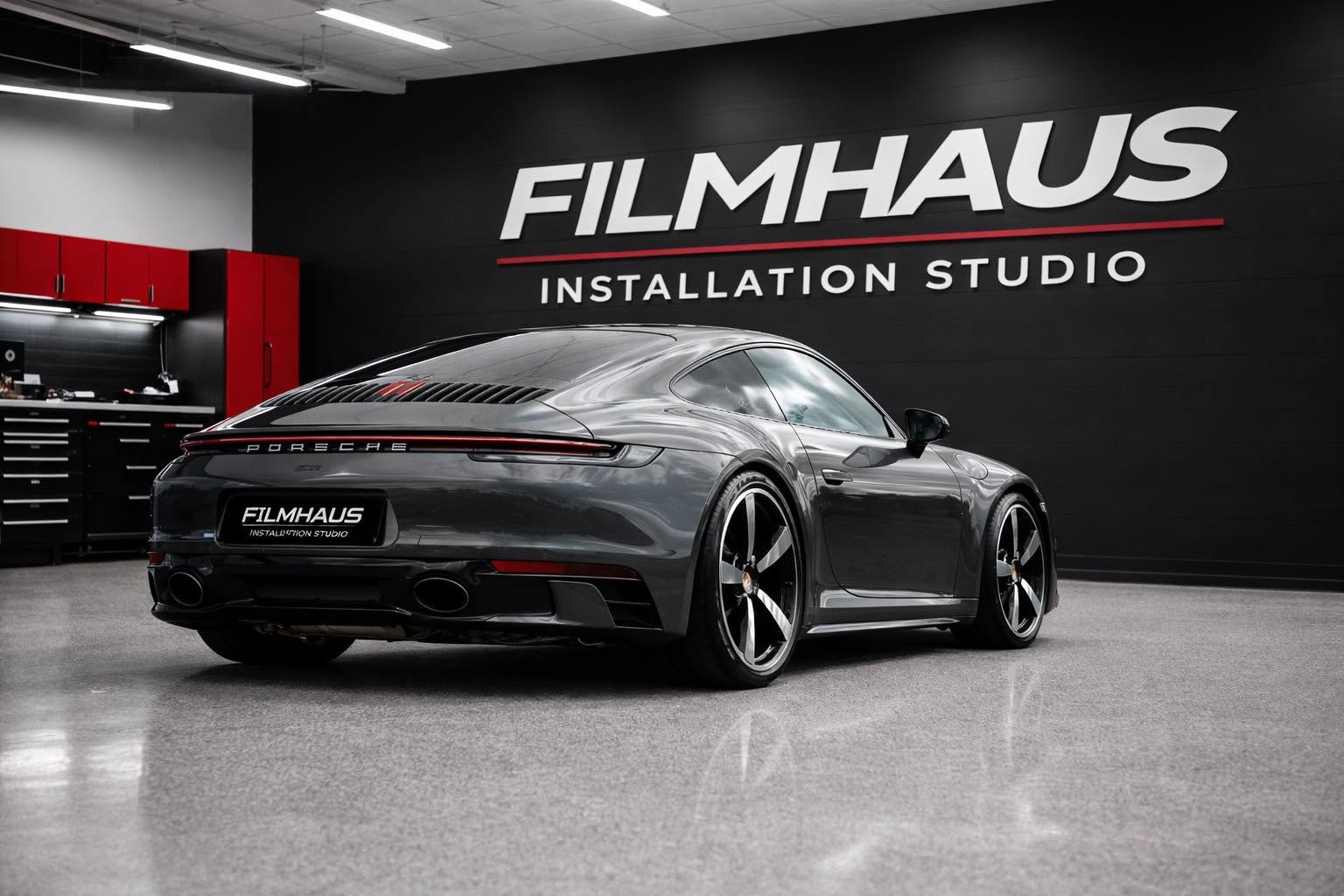 Gray Porsche 911 Carrera in the FILMHAUS install bay