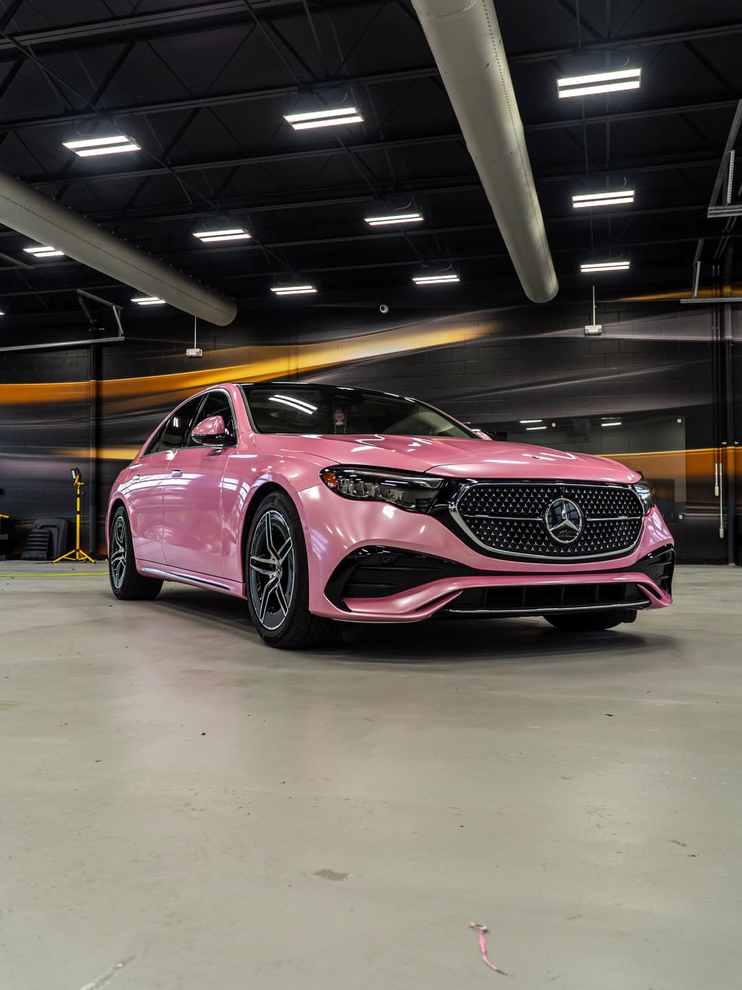 Mercedes sedan in a gloss pink color change wrap in the FILMHAUS studio